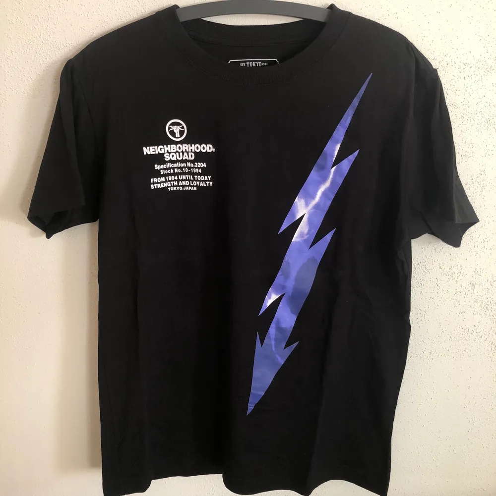 Neighborhood / NBHD Lightning Bolt T-Shirt  Size tag large, but fits like a men’s medium / small tee.  Great condition, no flaws or damage.  DM if you need exact size measurements.   Buyer pays for all shipping costs. All items sent with tracking number.   No swaps, no trades, no offers. . T-shirts.