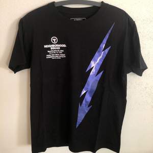 Neighborhood / NBHD Lightning Bolt T-Shirt  Size tag large, but fits like a men’s medium / small tee.  Great condition, no flaws or damage.  DM if you need exact size measurements.   Buyer pays for all shipping costs. All items sent with tracking number.   No swaps, no trades, no offers. 
