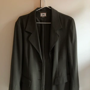 Grön kavaj - En mörkgrön oversized kavaj, passar som S/M.