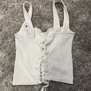 Korsett topp - ”Korsett” topp från Bershka i storlek M. Sparsamt använd. + 45 kr Frakt (inte spårbar)