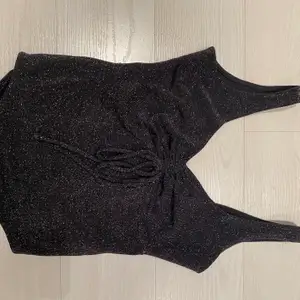 Black,sparkly bodysuit from Bershka. Scrunch detail at the front, and a low back. Perfect for New Years or a night out. The glitter does not fall/rub off on the skin! Worn 1-2 times and in perfect condition ✨✨