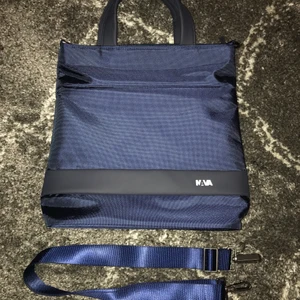 Waterproof Navy Tote from Nava - Waterproof navy tote from the brand Nava. Never worn, in perfect condition.
