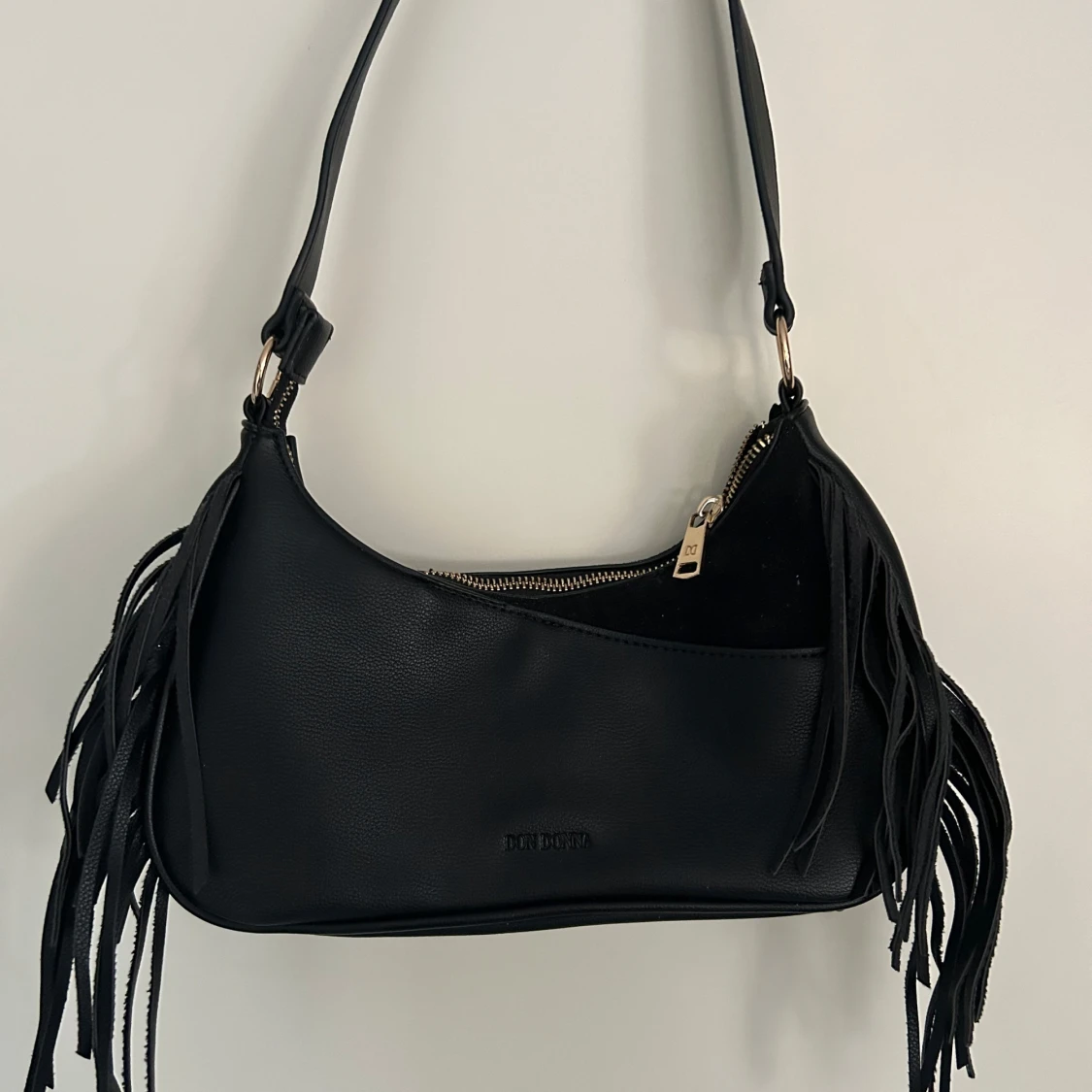 Väska med fransdetaljer