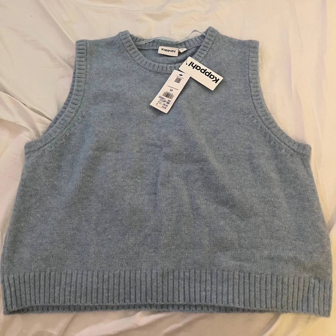 Ljusblå stickad väst från Kappahl