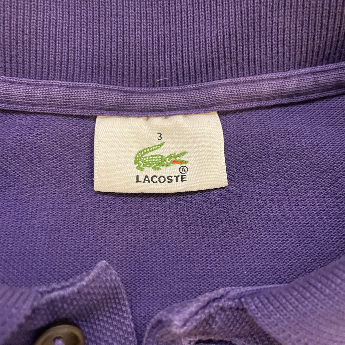 Lila pikétröja från Lacoste - 92