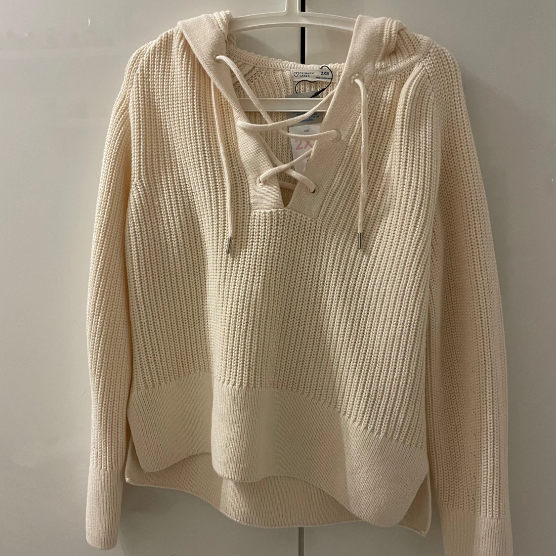 Beige stickad hoodie från Primark - 90