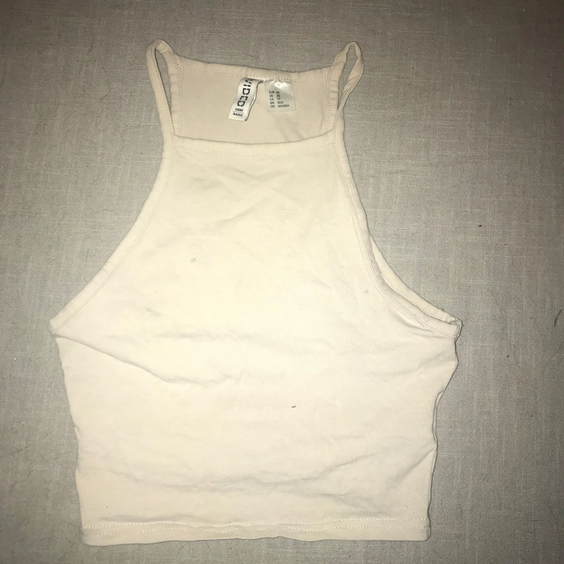 Beige ärmlös linnetopp