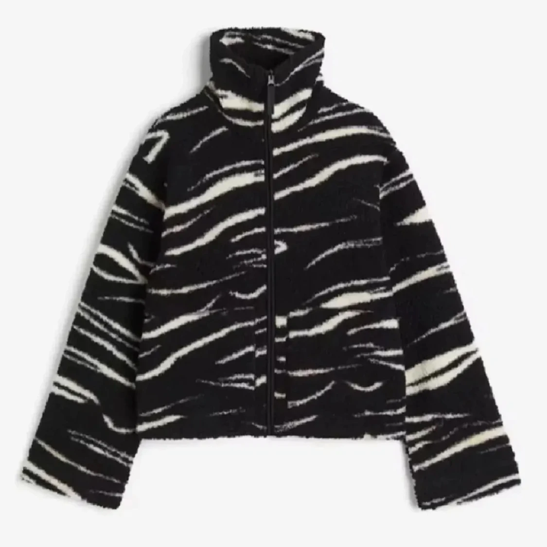 Svart och vit teddyjacka