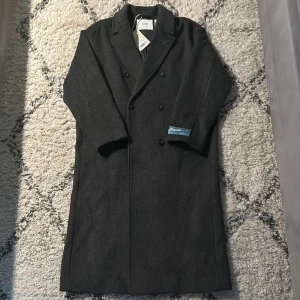 Axel Arigato ullkappa - Axel Arigato ullkappa som köptes på en Axel.A pop up store, kvitto finns. Nytt pris på en sån här är runt 6000-8000kr.