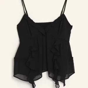 Svart ärmlös topp med volanger - Snygg svart ärmlös topp med tunna axelband och volangdetaljer. I ett lätt och luftigt material. (Endast prövad )