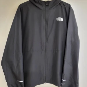 The North Face vindjacka herr - Vindjacka Windwall  i nyskick från The North Face i strl. L.