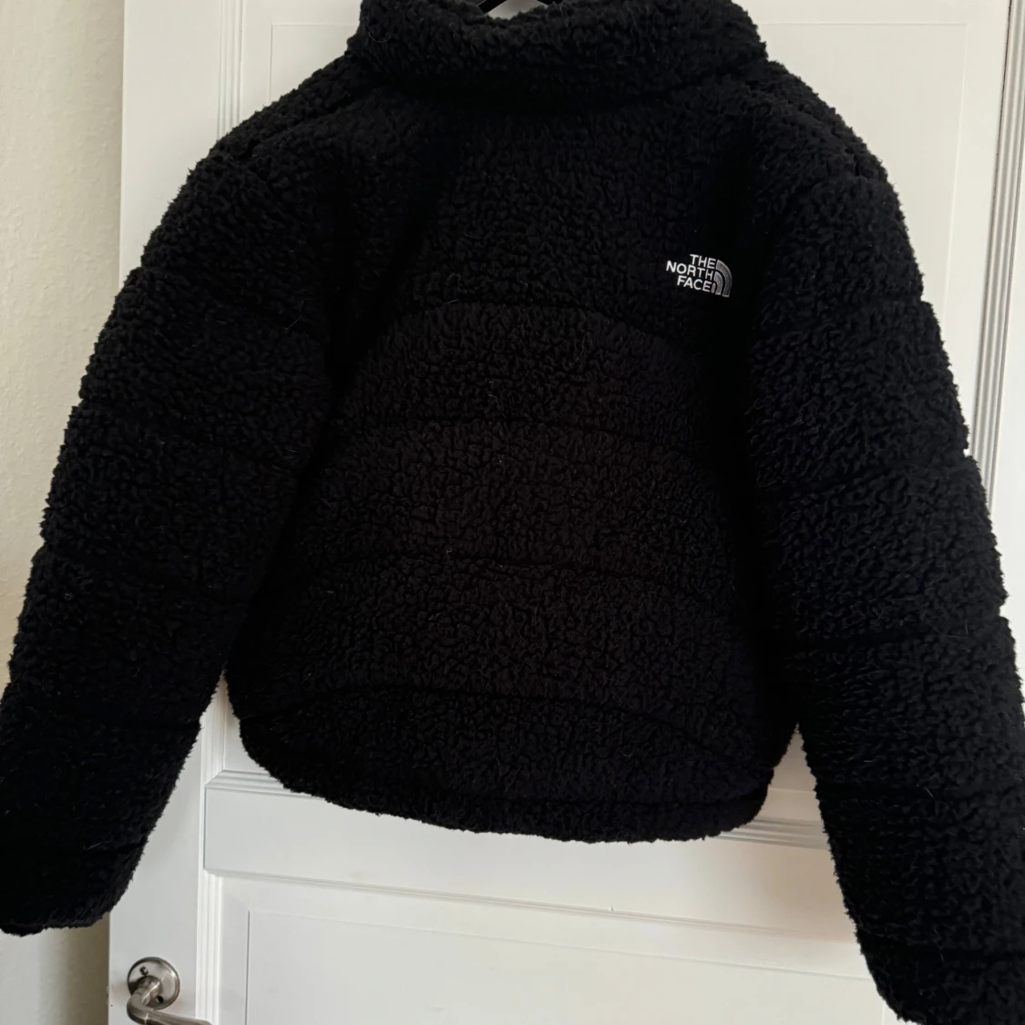 Svart teddyjacka från The North Face - 90