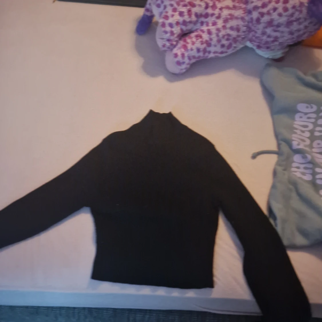 Svart polotröja i storlek XS