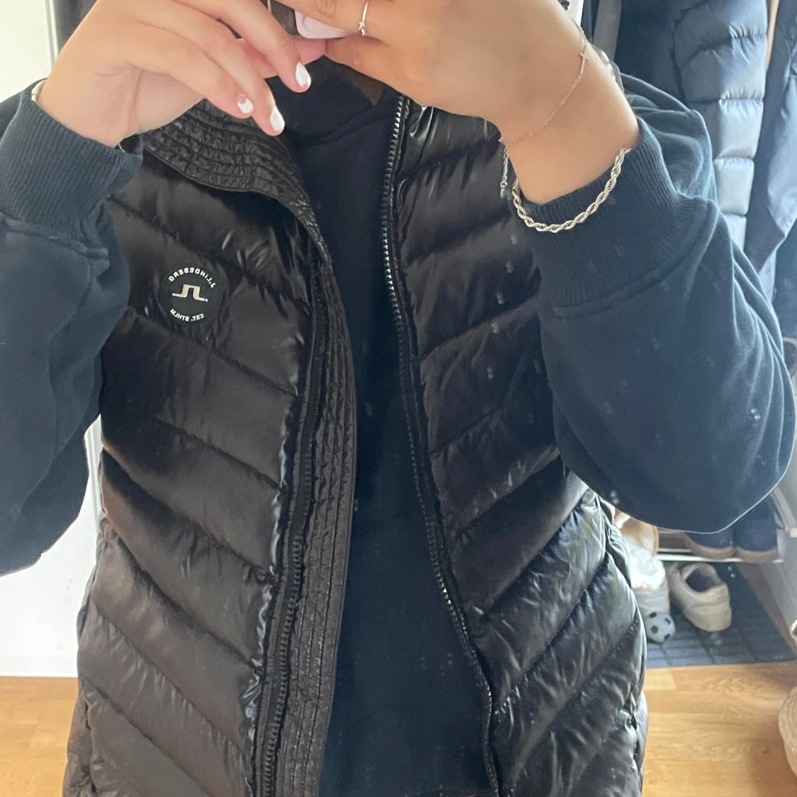 Svart dunväst från J.Lindeberg XL