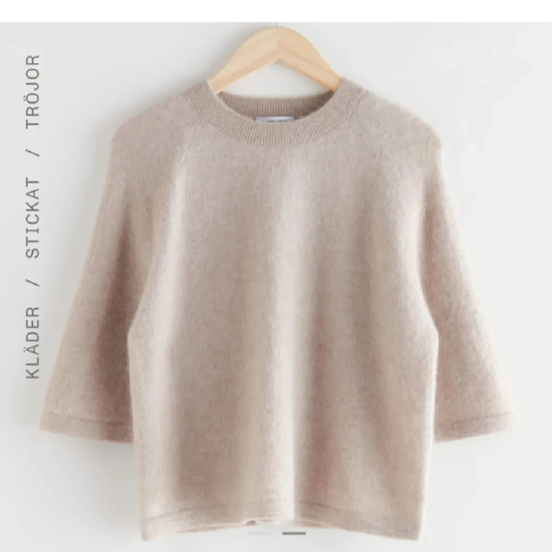 Beige stickad tröja med trekvartsärm