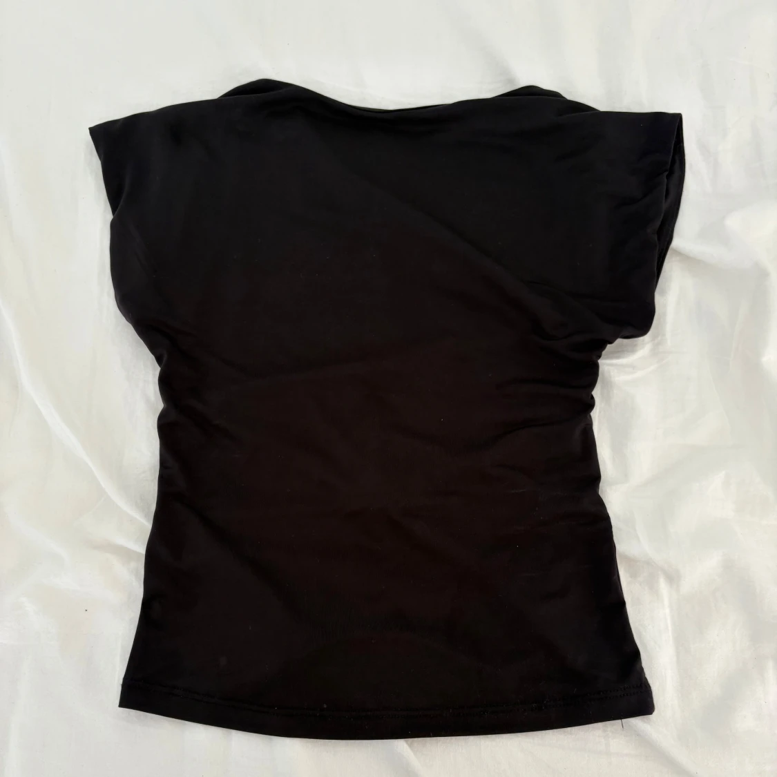 Svart backless top från Stradivarius XS