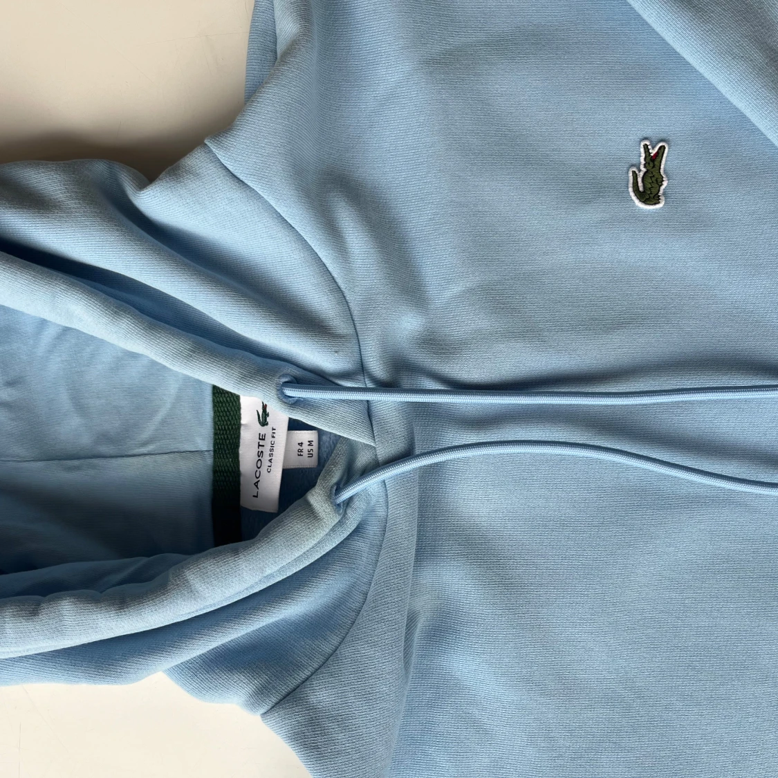 Ljusblå hoodie från Lacoste - 2