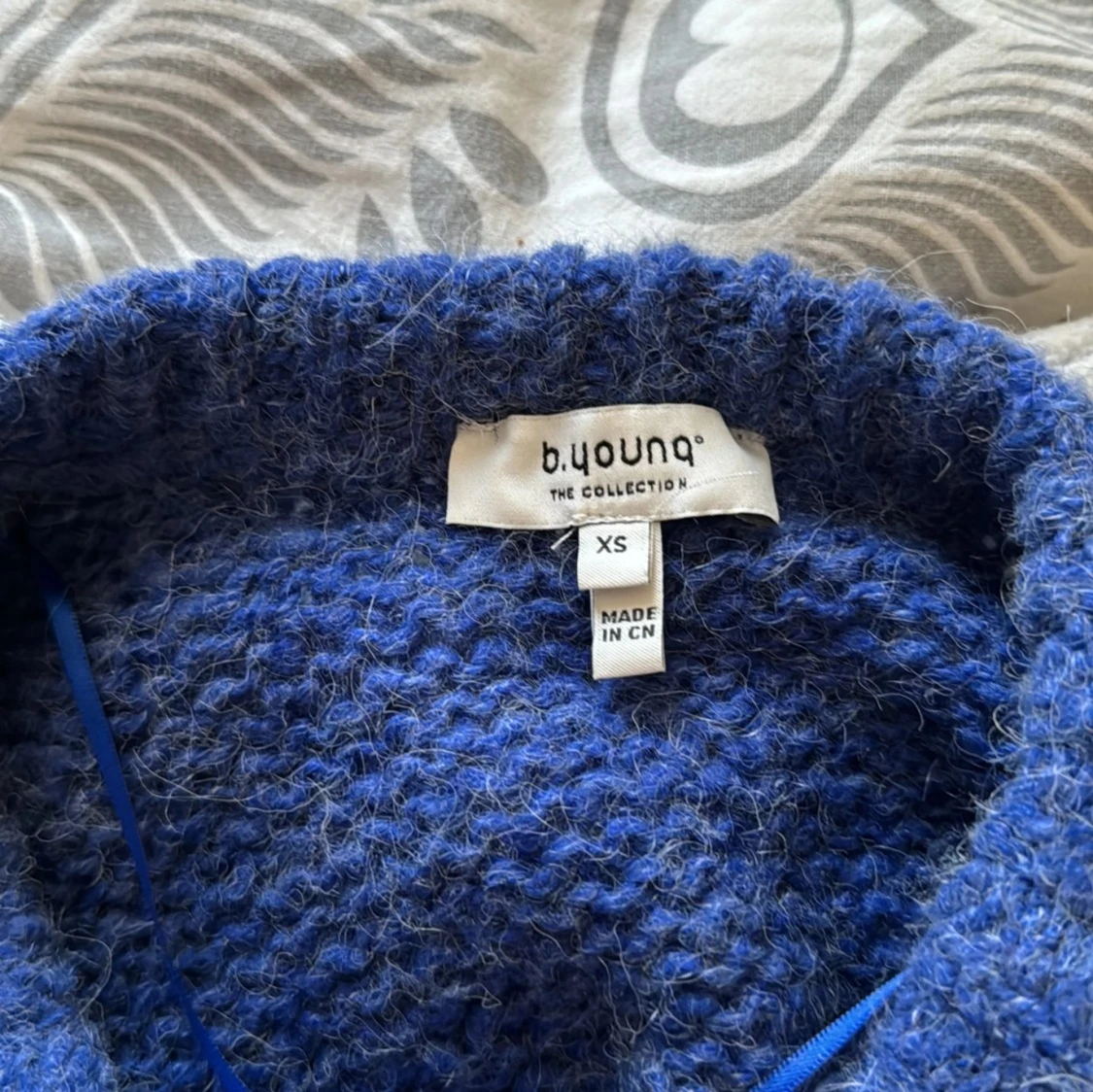 Stickad blå tröja  - 93