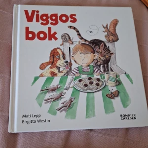Viggos bok - En charmig bilderbok med färgglada illustrationer av Viggo, hans djurvänner och vardagsäventyr. Perfekt för unga läsare som gillar djur och roliga berättelser.