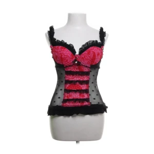 Svart och rosa korsett från Soleil Sucré - Snygg svart och rosa korsett från Soleil Sucré med prickigt mönster på sidorn. Den har många små fina detaljer, som små rosetter blommor. Uppskattar att de är storlek s / xs. Kupan är 70B EU.