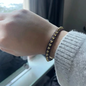 armband med guldnitar - armaband från edblad. Används ej