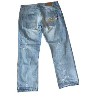Baggy Southpole jeans W38 [Ytterbenslängd 106cm] [Innerbenslängd 73cm] [Midja 50cm] [Benöppning 23cm]