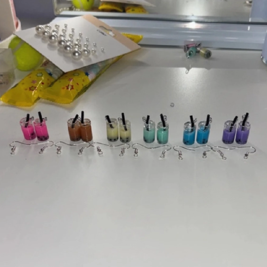 Boba berlocker som örhängen