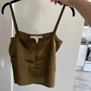 Silkestopp - Fin vintage topp i silke i finaste gröna färgen! Passar xs-s. Bra kvalitet