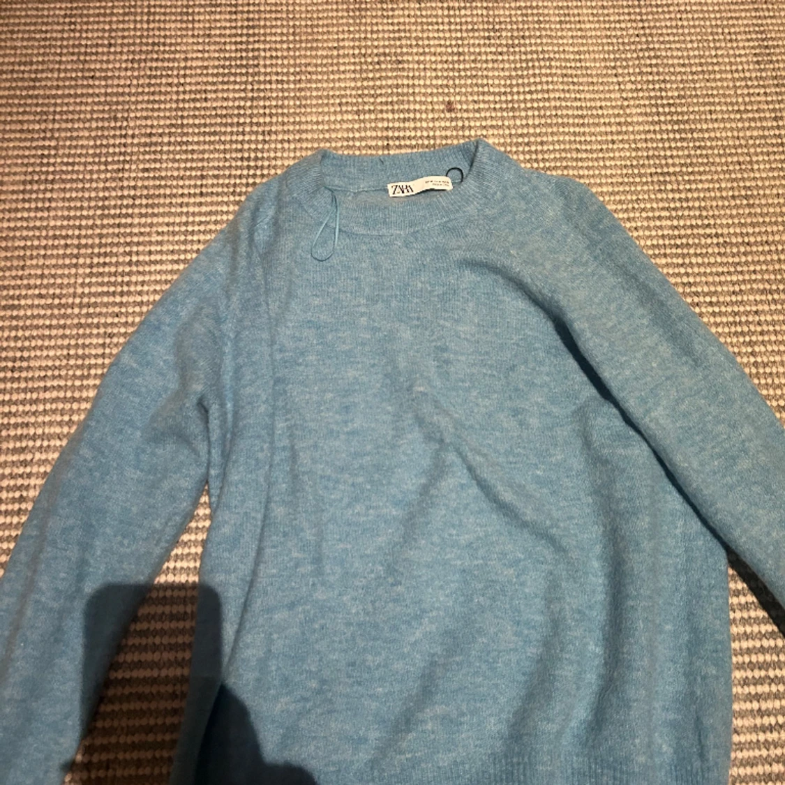 Stickad blå tröja - 91