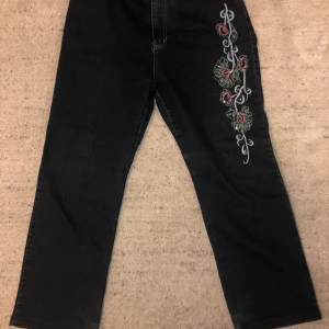 Thrifted flower jeans - Thrifted jeans good condition no damage. Sewn flowe pattern on roght leg and back right pocket.