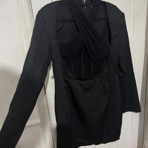 Black dress worn once as seen on pictures. Not true to size. Fits size 16/18
