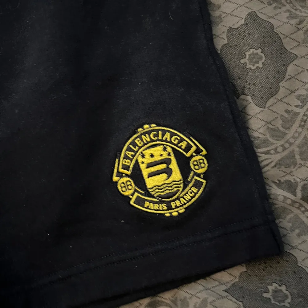Balenciaga Crest soccer Shorts, condition 9/10 (tag has been cut) gaurentees authenticty with reciept from trusted source, beautiful piece great for the summer and the warm days not so oversized fit normal typa short fit.. Shorts.