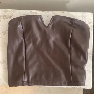 Korsett - Storlek xs, har en dragkedja.