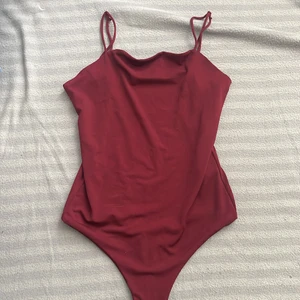 Body  - Helt oanvänd , body med knappar. 