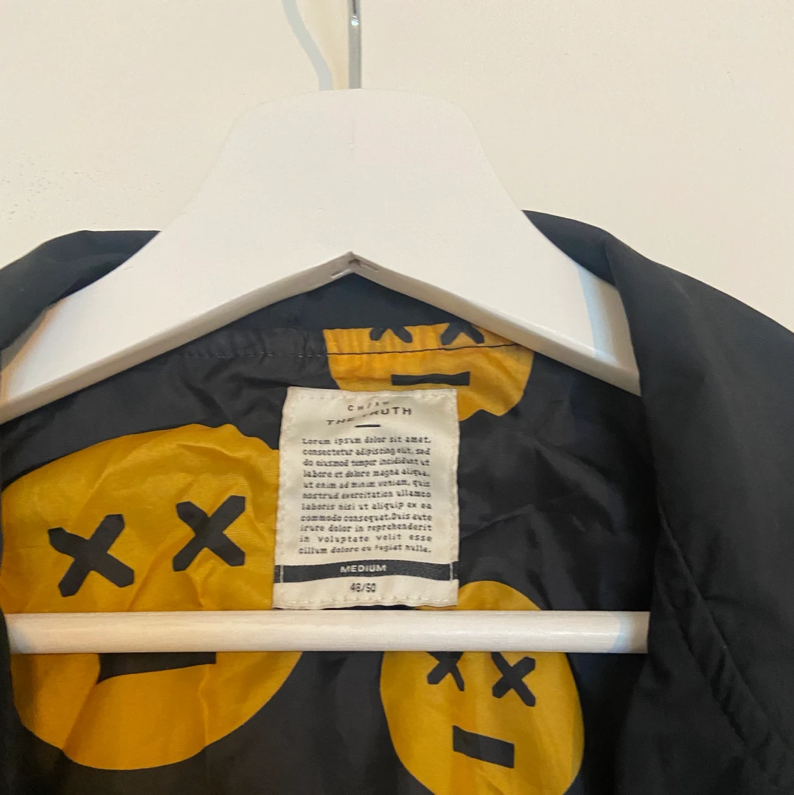 Blå regnjacka med smile ansikten  - 90