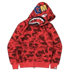 Shark bape ziphoodie - Säljer denna ziphoodie pågrund av att jag har 2 i samma färg, använd 1 gång, (ny skick) köpt för 700 men säljer för 400 då jag vill bli av med den. pris går  att diskutera!💗(inte äkta!)