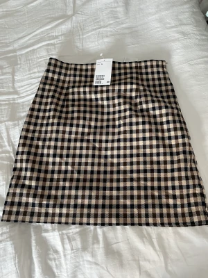 Ny minikjol! - Ny fin minikjol i rutigt mönster!