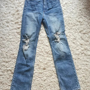 Slight wide leg, mid waist pants  - Bought a size too small so I could never wear it