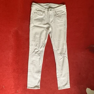 White jeans - Rag&Bone white jeans with stylish openings. Tight till the ankles. Low waist. Would look amazing with a crop top 