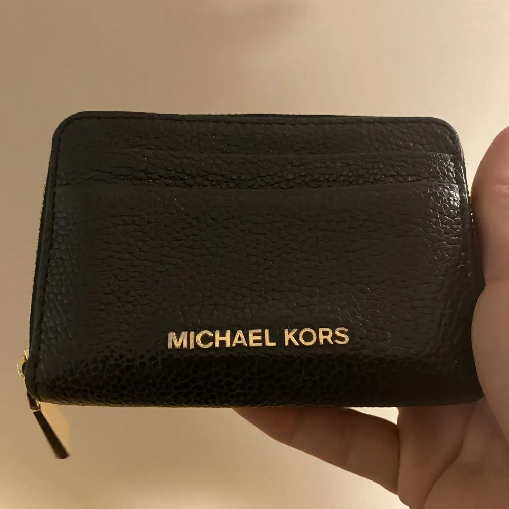 Plånbok fr Michael Kors.  Fint skick. Väskor.