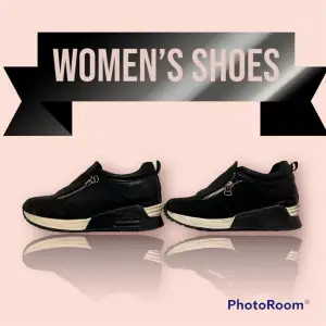 Ett par svart/vita fashioned womenswear  sport skor storlek 40