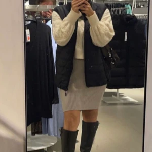 Väst  - Lång väst i storlek M