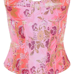 Korsett topp - En prettylittle thing corset top med ett blommigt tryck, i storlek UK 8 EU 36. Det är ett satin liknande material som glänser väldigt fint. Toppen har använts en gång.  Obs: köparen står för frakt! 