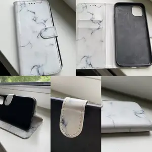 Ett vitt marmor plånboksfodral till iPhone 11 PRO MAX som är använd men i bra skick. Som man kan se på 2 av bilderna så är det lite rosa missfärgat men det ska nog gå att få bort💗🌸🤍 köptes för 99kr 