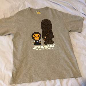 OG BAPE- A BATHING APE BABY MILO X STAR WARS CHEWBACCA TEE. Rare OG bape from 2006-2007 before Nigo left.   The t shirt is brand new and has been used only once , also opened a few months ago from the packaging “Only serious offers»
