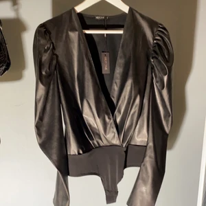 Topp - Oanvänd topp från Nelly. 