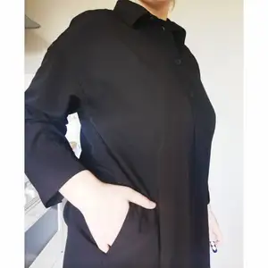 Black oversized shirt-dress. 