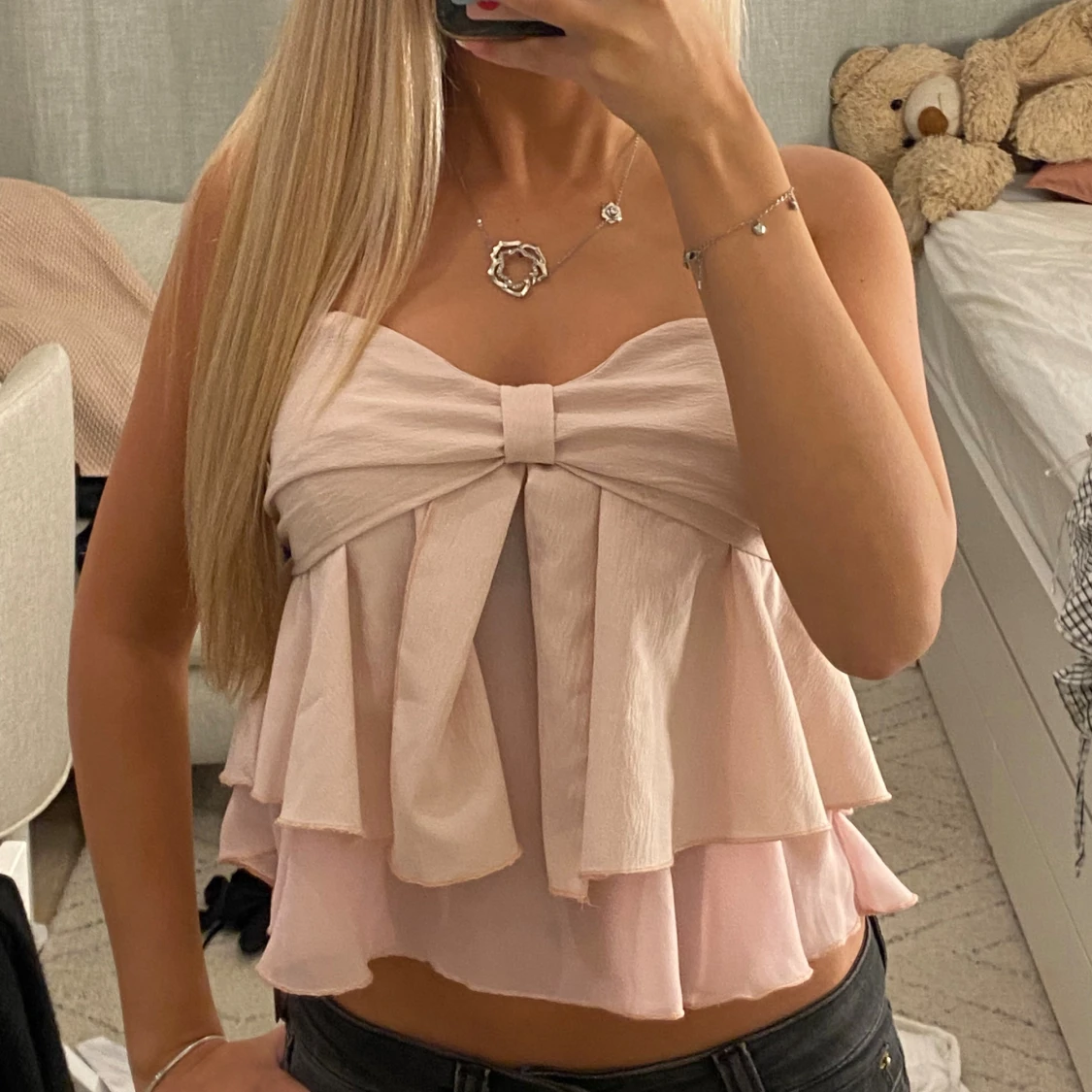 Ljusrosa volangig tubtopp med rosett