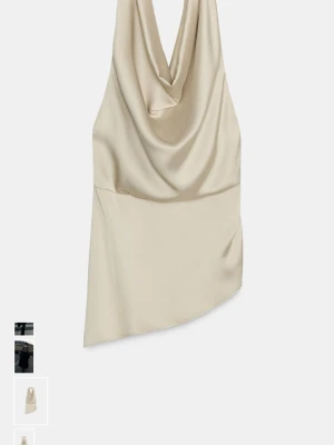 Champagnefärgad satin linnetopp  - Säljer en elegant champagnefärgad festtopp i satin med draperad halsringning och asymmetrisk nederkant. Köpt från Zara men var för liten för mig. Har fortfarande prislapp kvar. 