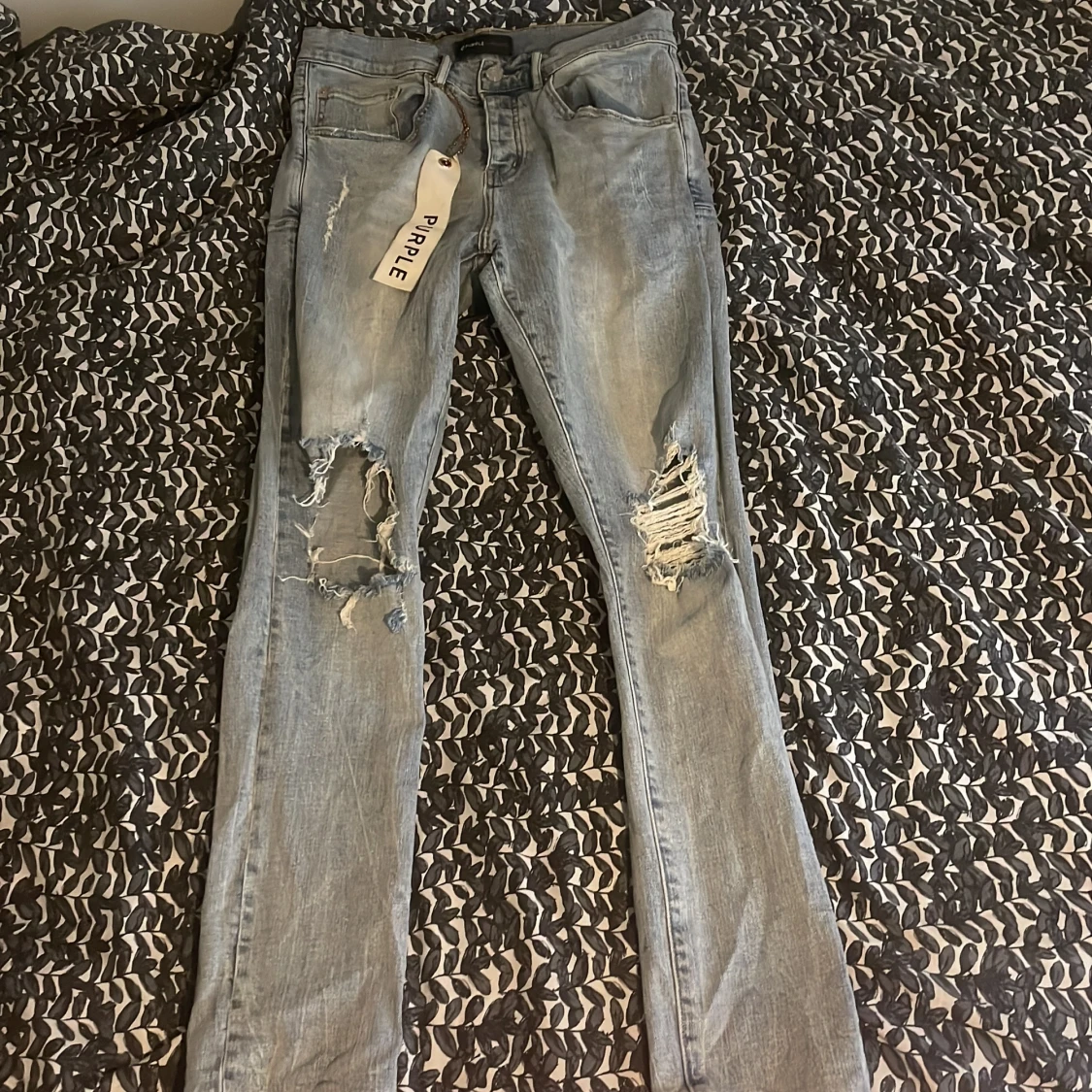 Ljusblå ripped jeans från Purple Brand